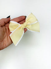 Load image into Gallery viewer, Maeve | Textured Pale Yellow Ruffle Bow | Standard | Left Clip
