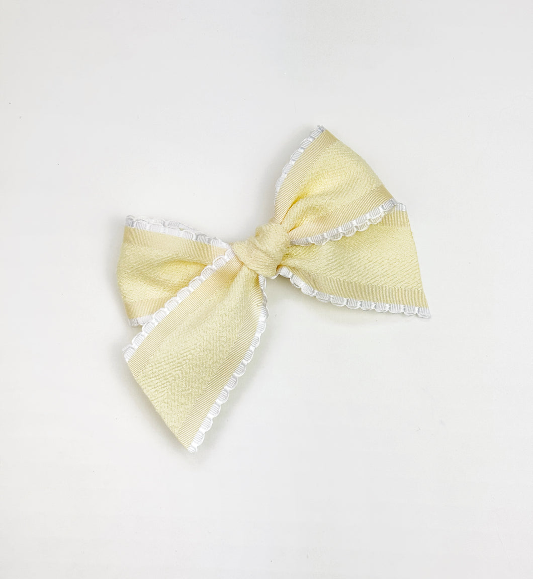 Maeve | Textured Pale Yellow Ruffle Bow | Standard | Left Clip